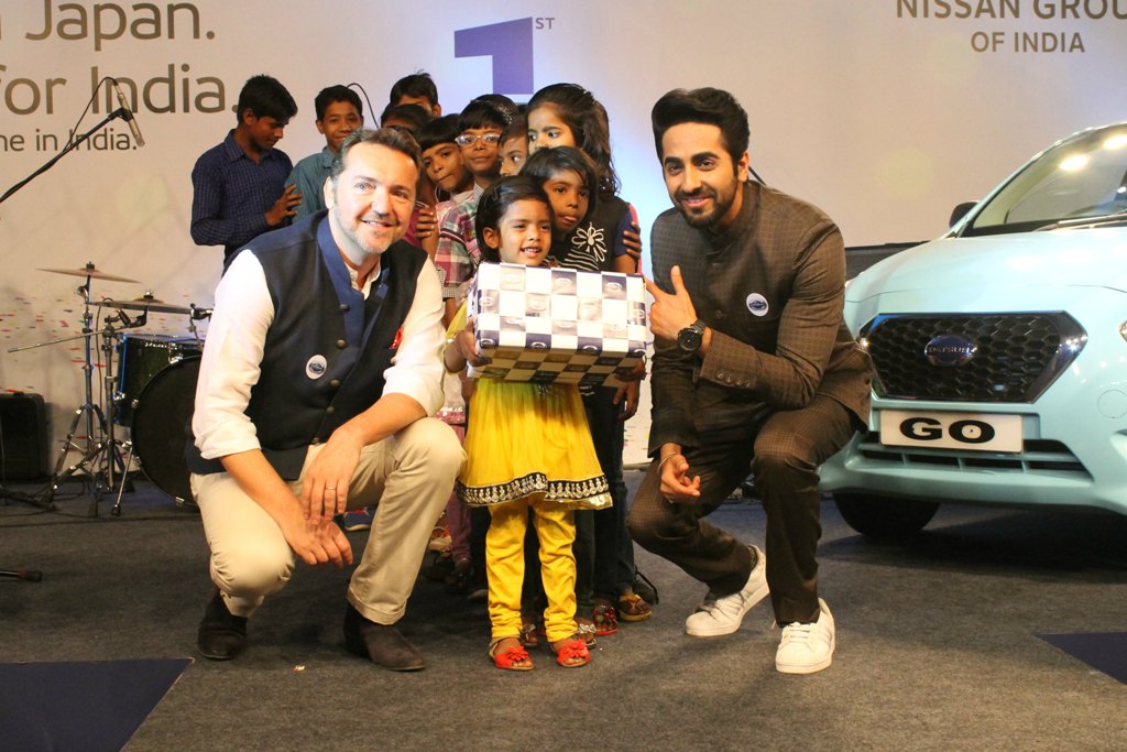 Guillaume Sicard & bollywood star Ayushmann Khurana celebrating Datsun's 1st brand anniversary with underprivileged children
