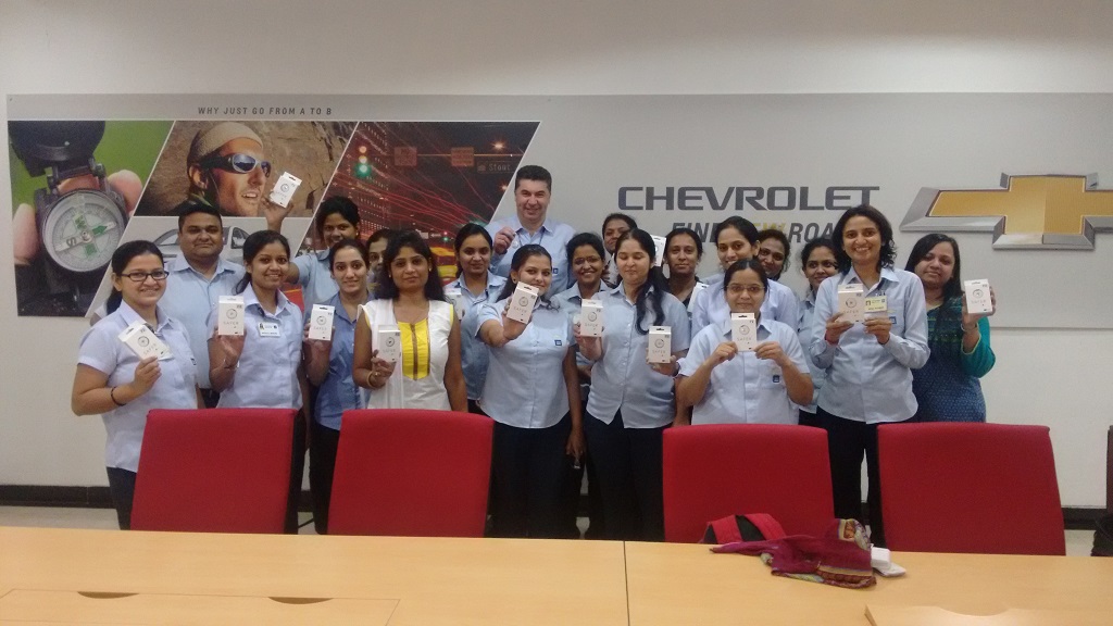 Kaher Kazem,President & MD, GM India giving the SAFER device to the women employees at Talegaon