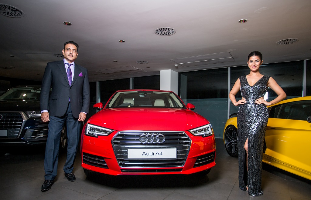 bollywood-actress-nimrat-kaur-and-former-indian-cricketer-ravi-shastri-at-the-launch-of-the-new-audi-a4-in-new-delhi