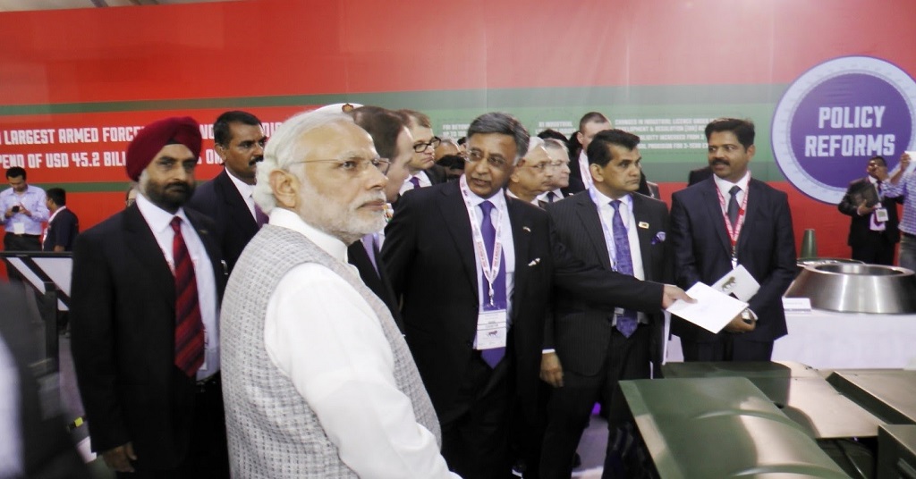 Honourable Prime Minister Shri Narendra Modi with Baba N. Kalyani, Chairman and Managing Director, Bharat Forge Limited during his visit to the company’s booth in Defence Pavilion at Make In India Week Centre