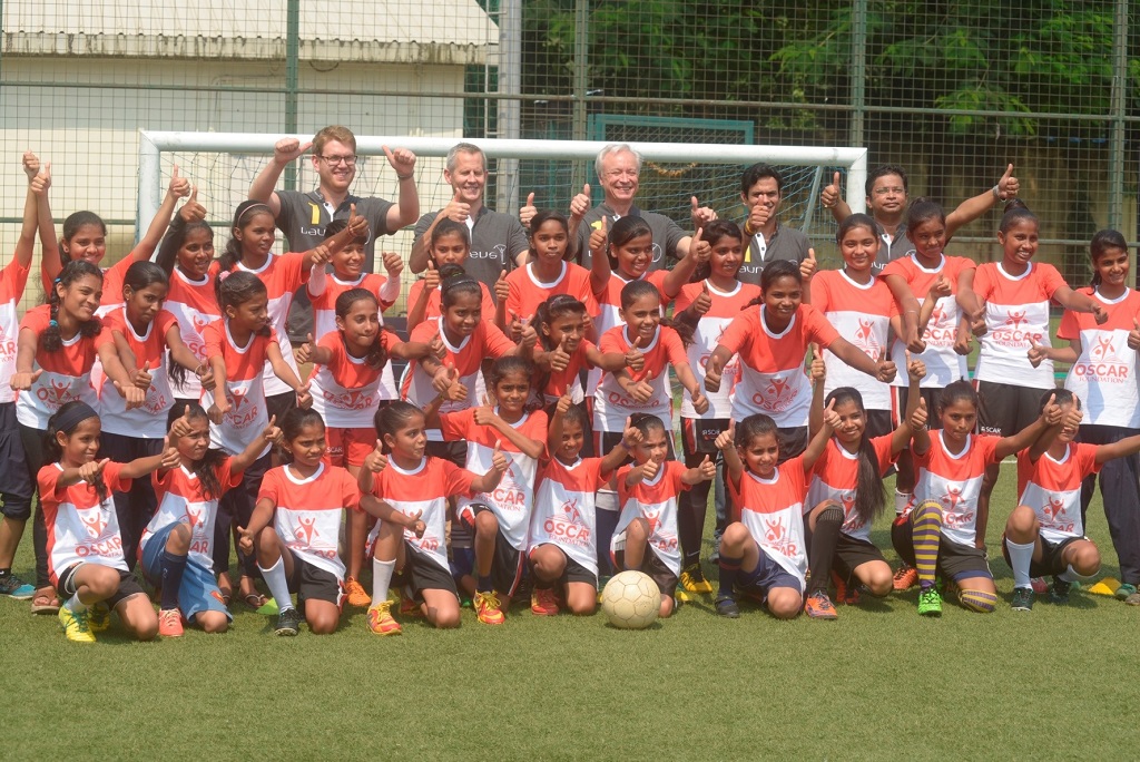 mercedes-benz-india-management-with-oscar-foundation-kids-on-the-football-ground-1